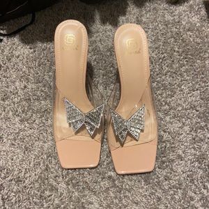 Nude and clear heels with rhinestone butterfly